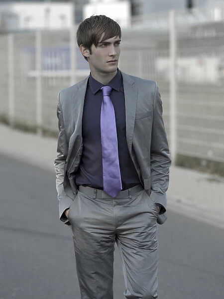 Man in suit in an industrial area