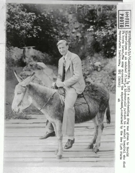 Framed Print : Man in Suit seated on a Mule