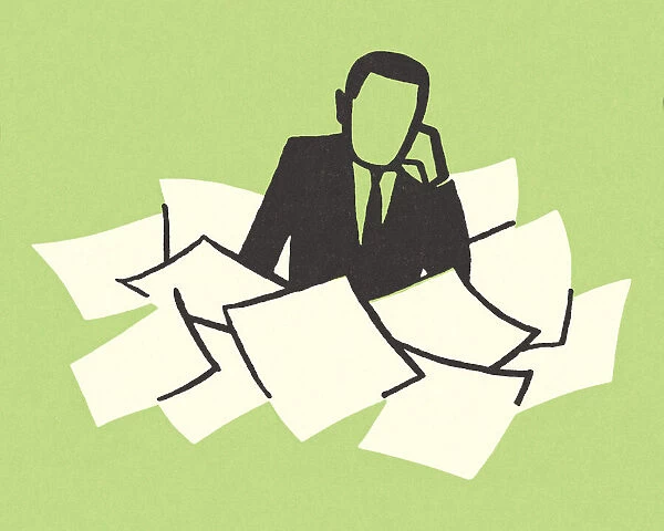 Man Surrounded with Paperwork