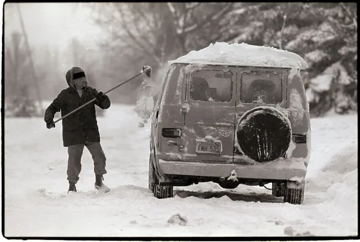 Framed Print : Man Sweeping Snow from Van Framed Print : Man Sweeping Snow from Van