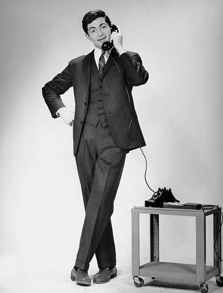 Man talking on telephone while standing