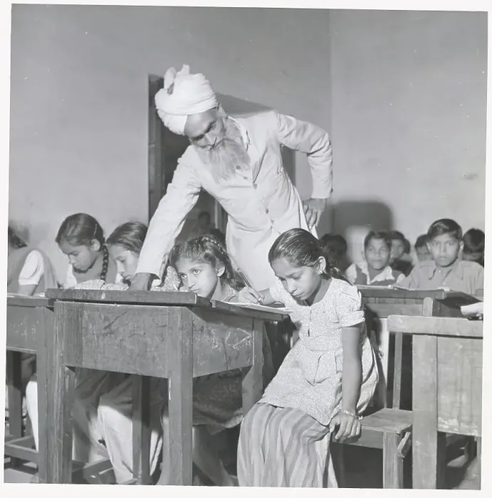 Framed Print : Man Teaching Youngsters in Classroom Framed Print : Man Teaching Youngsters in Classroom
