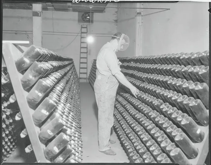 Framed Print : Man Turning Bottles of Champagne Framed Print : Man Turning Bottles of Champagne