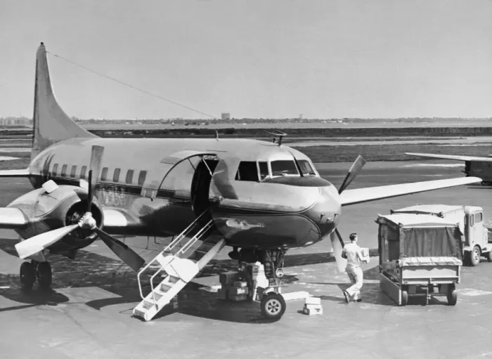 Framed Print : Man unloading cargo from plane Framed Print : Man unloading cargo from plane