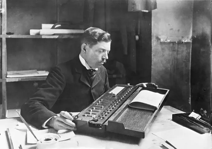 Framed Print : Man Using Calculating Machine Framed Print : Man Using Calculating Machine