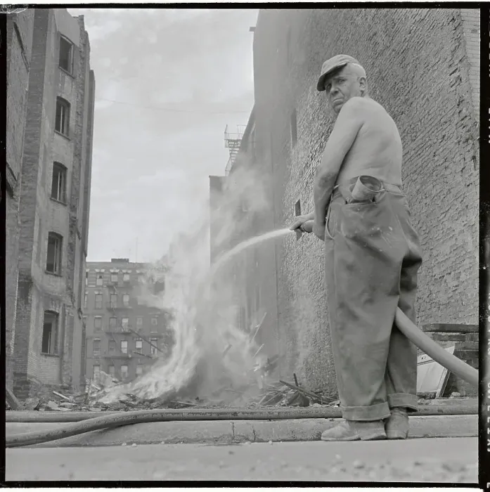 Framed Print : Man Using Hose to Contain Fire Framed Print : Man Using Hose to Contain Fire