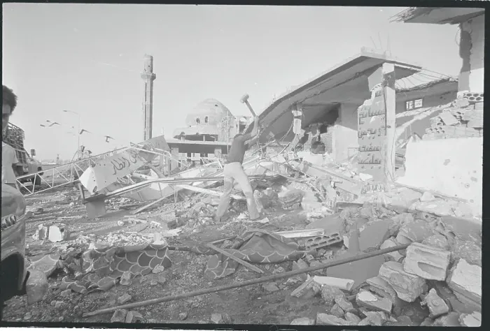 Framed Print : Man Using Sledge to Remove War Torn Debris Framed Print : Man Using Sledge to Remove War Torn Debris