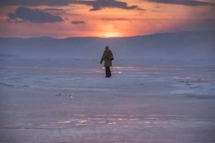 Framed Print : a man walking on a frozen lake Baikal Framed Print : a man walking on a frozen lake Baikal