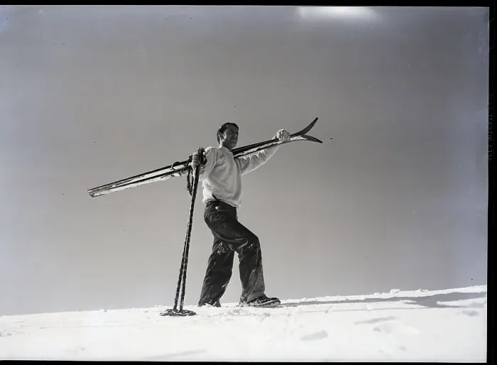 Framed Print : Man Walks Through Snow with Skis on Shoulder Framed Print : Man Walks Through Snow with Skis on Shoulder