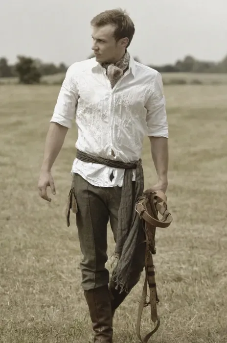Framed Print : Man wearing riding clothes walking in a field in summer Framed Print : Man wearing riding clothes walking in a field in summer