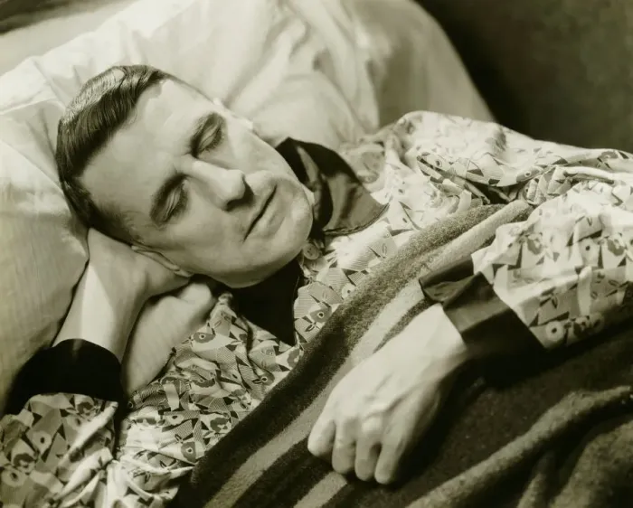 Framed Print : Man wearing silk pyjamas sleeping in bed, (B&W), elevated view Framed Print : Man wearing silk pyjamas sleeping in bed, (B&W), elevated view