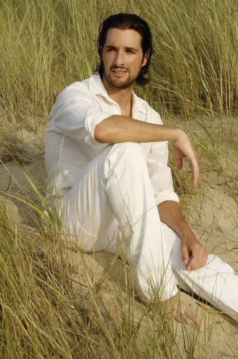 Framed Print : Man wearing white clothes sitting in the dunes Framed Print : Man wearing white clothes sitting in the dunes