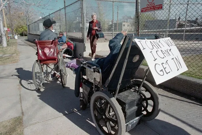 Framed Print : Man in Wheelchair Trying to Vote Framed Print : Man in Wheelchair Trying to Vote