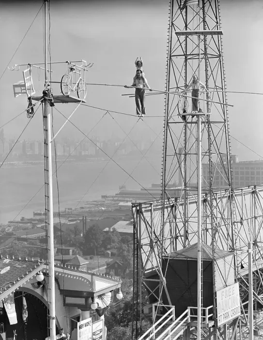 Framed Print : Man and Woman Holding Pole on Highwire Framed Print : Man and Woman Holding Pole on Highwire
