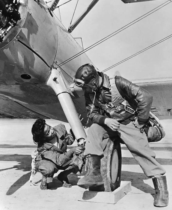 Framed Print : Man and Woman Look at Plane Underside Framed Print : Man and Woman Look at Plane Underside