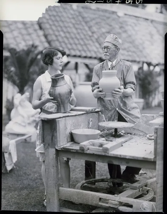 Framed Print : Man, Woman At Old Foot-Driven Pottery Wh Framed Print : Man, Woman At Old Foot-Driven Pottery Wh
