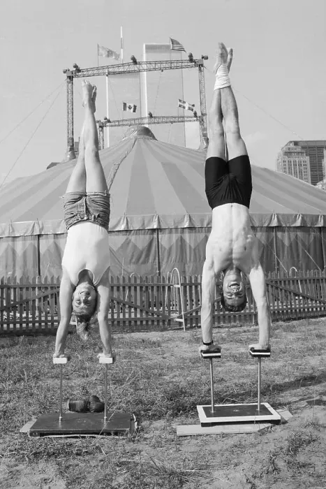 Framed Print : Man and Woman Practice Handstands