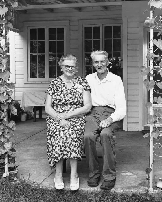 Framed Print : Man and woman sitting on porch Framed Print : Man and woman sitting on porch