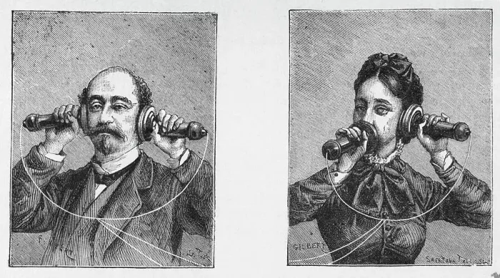 Framed Print : Man And Woman Using Old Fashioned Phones Framed Print : Man And Woman Using Old Fashioned Phones