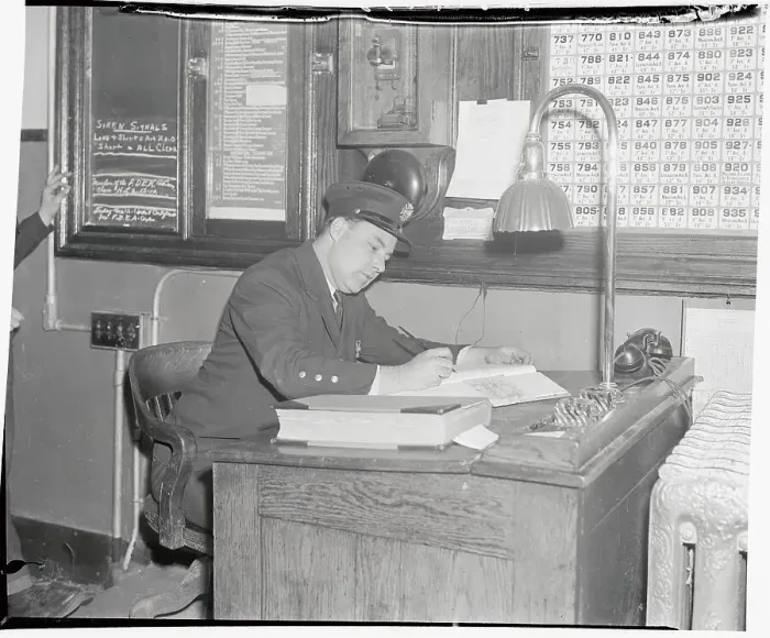 Framed Print : Man Working in Department Answering Raid Alarm Office Framed Print : Man Working in Department Answering Raid Alarm Office