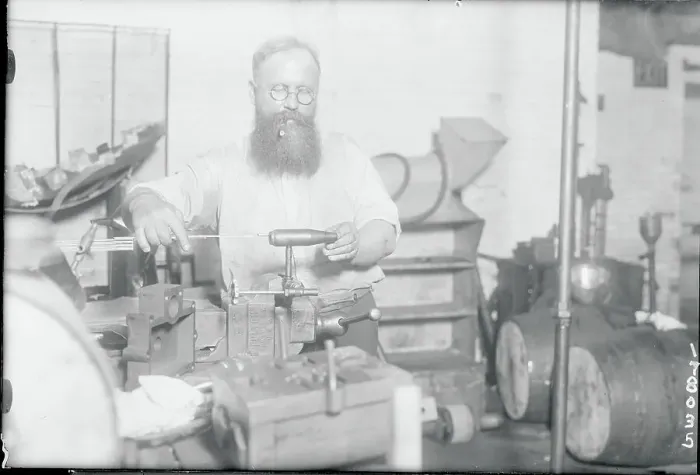 Framed Print : Man Working on His Invention