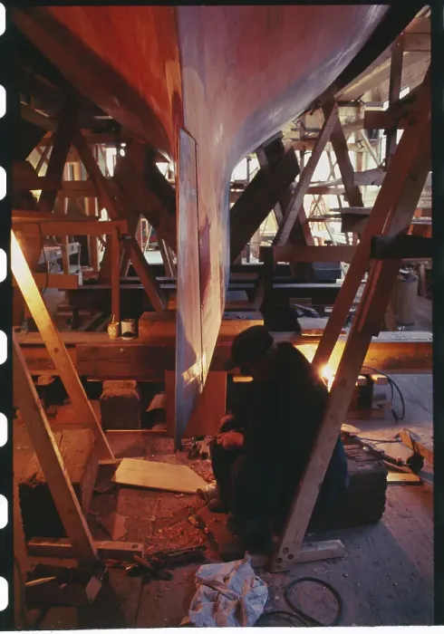 Framed Print : Man Working on Yacht Construction Framed Print : Man Working on Yacht Construction