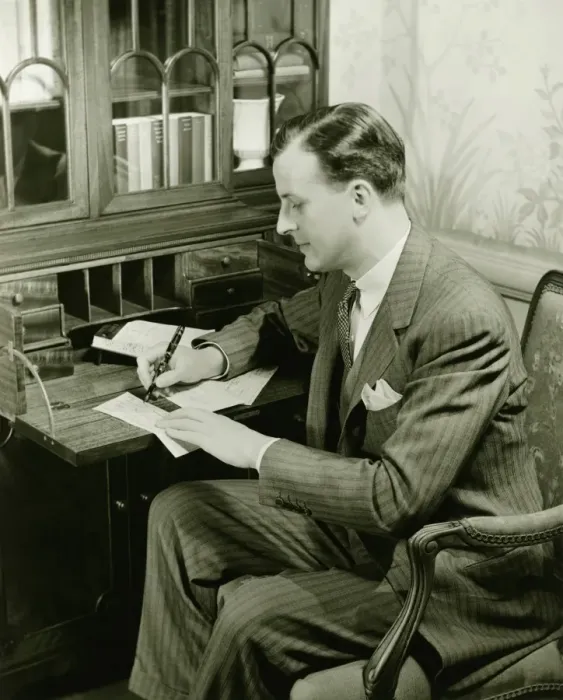 Framed Print : Man writing letter at bureau, (B&W) Framed Print : Man writing letter at bureau, (B&W)