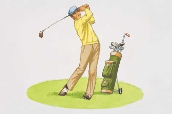 Framed Print : Man in yellow jumper, beige trousers and cap swinging golf club, golf bag on trolly at his side Framed Print : Man in yellow jumper, beige trousers and cap swinging golf club, golf bag on trolly at his side