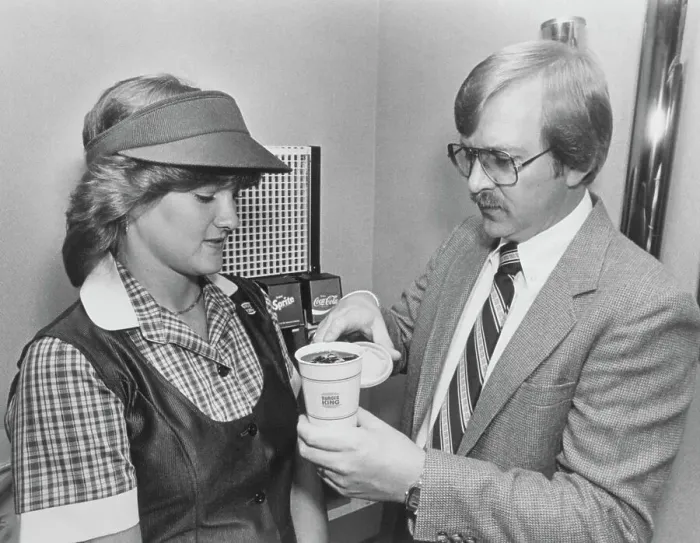 Framed Print : Manager Teaching Employee to Pour Drink Framed Print : Manager Teaching Employee to Pour Drink