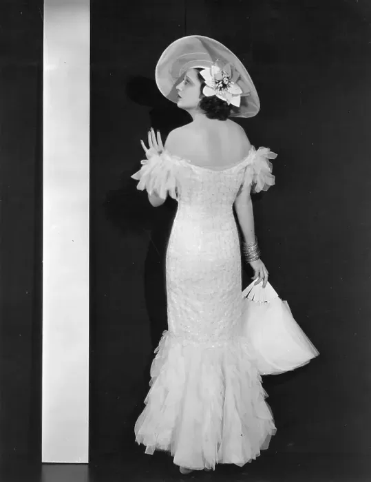 Framed Print : Mandalay. 1934: Kay Francis (1899 - 1968) wears a day dress of pale pink Framed Print : Mandalay. 1934: Kay Francis (1899 - 1968) wears a day dress of pale pink
