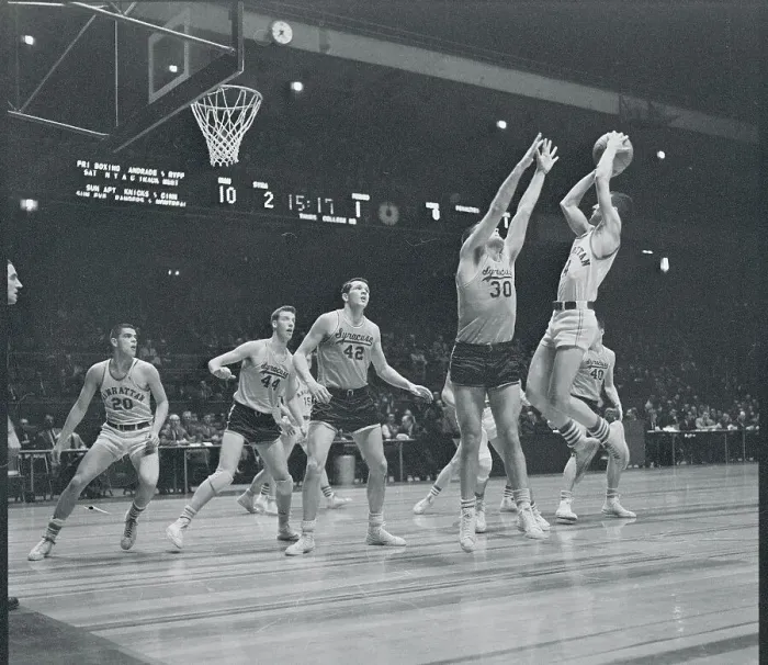 Framed Print : Manhattan and Syracuse Players Playing Hard on the Court Framed Print : Manhattan and Syracuse Players Playing Hard on the Court