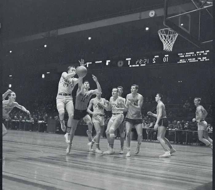 Framed Print : Manhattan and Syracuse Players Playing Hard on the Court Framed Print : Manhattan and Syracuse Players Playing Hard on the Court