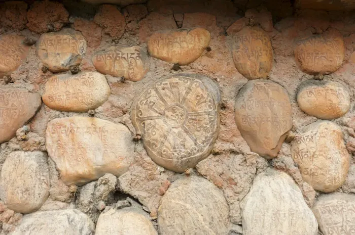 Framed Print : Mani stones with Tibetan inscriptions on wall, Buddhist Mani wall at Ghami, Upper Mustang, Nepal, Asia Framed Print : Mani stones with Tibetan inscriptions on wall, Buddhist Mani wall at Ghami, Upper Mustang, Nepal, Asia