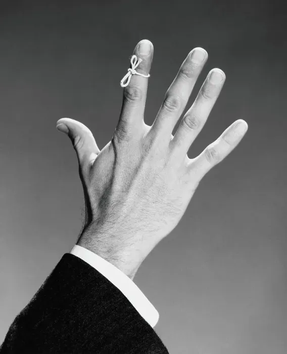 Framed Print : Man's hand with string tied around index finger Framed Print : Man's hand with string tied around index finger