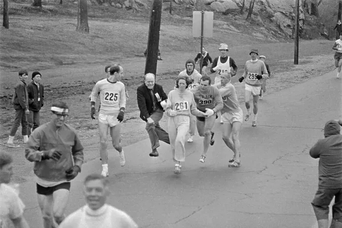 Framed Print : Marathon Director Bill Cloney Trying to Stop Female Runner Framed Print : Marathon Director Bill Cloney Trying to Stop Female Runner
