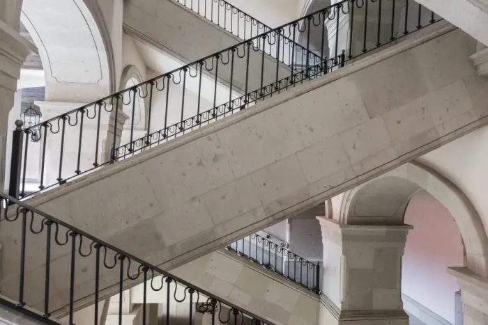 Framed Print : Marble stairways with ornate black metal railing