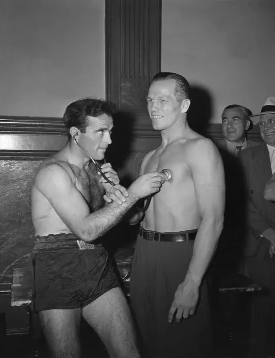Framed Print : Marcel Cerdan Using Stethoscope on Tony Zale