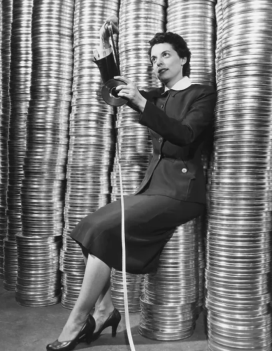 Framed Print : Marcia Drennen Posed W / Film Reel Stacks