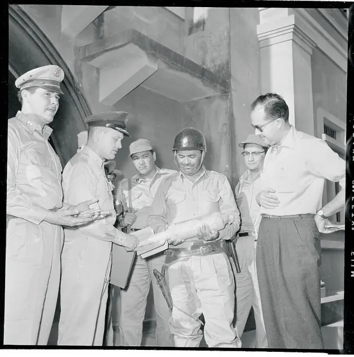 Framed Print : Marciano Aguiluz Holding a Bomb Framed Print : Marciano Aguiluz Holding a Bomb