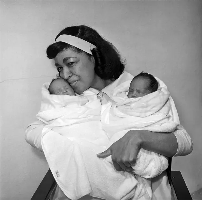 Framed Print : Maria Cole Holding Babies Framed Print : Maria Cole Holding Babies