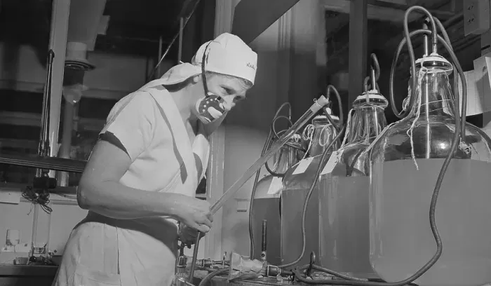 Framed Print : Marie Wooster Working with Vaccine