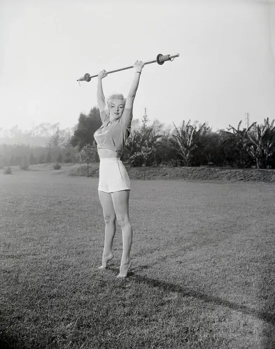 Framed Print : Marilyn Monroe Exercising on Grass Framed Print : Marilyn Monroe Exercising on Grass