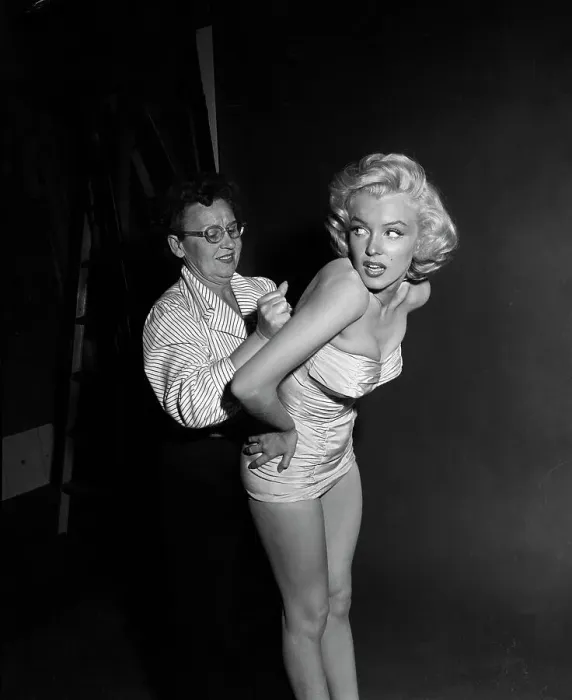 Framed Print : Marilyn Monroe Being Fitted into a Swimsuit Framed Print : Marilyn Monroe Being Fitted into a Swimsuit