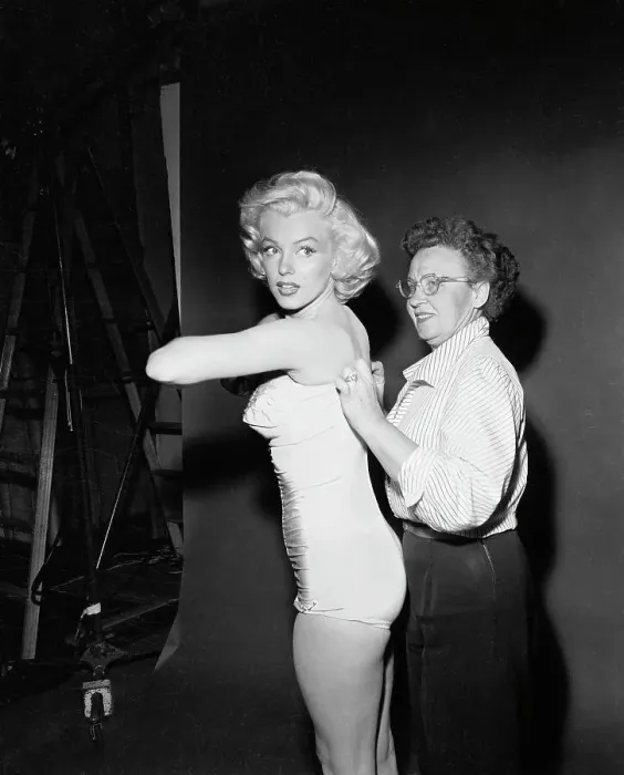Framed Print : Marilyn Monroe Getting Help with Bathing Suit Framed Print : Marilyn Monroe Getting Help with Bathing Suit