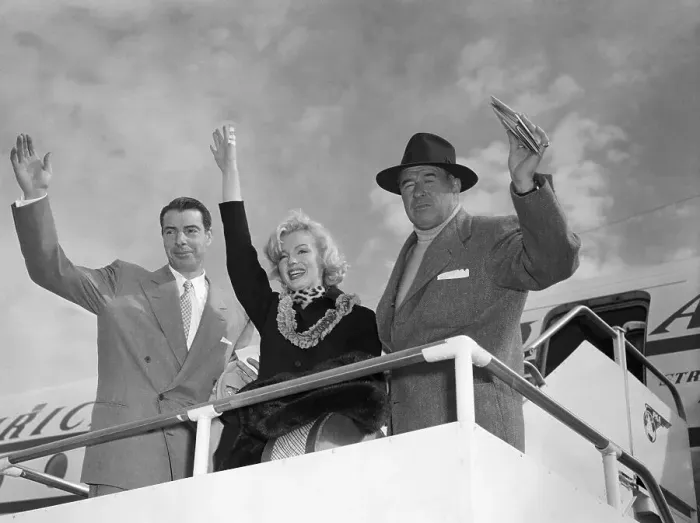 Framed Print : Marilyn Monroe and Joe DiMaggio Waving From Plane Framed Print : Marilyn Monroe and Joe DiMaggio Waving From Plane
