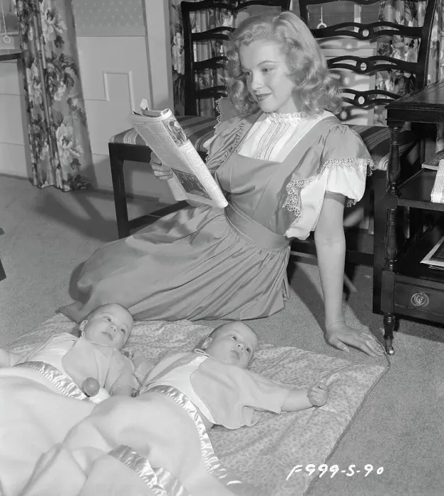 Framed Print : Marilyn Monroe Reading as Babies Keep Quiet