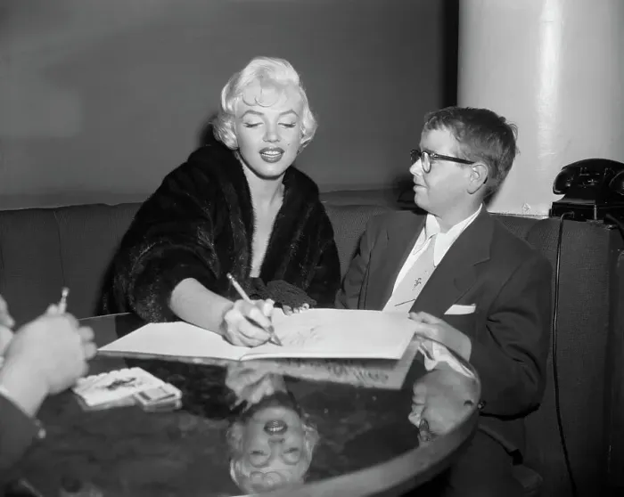 Framed Print : Marilyn Monroe Sitting with Young Boy Wearing Eyeglasses Framed Print : Marilyn Monroe Sitting with Young Boy Wearing Eyeglasses