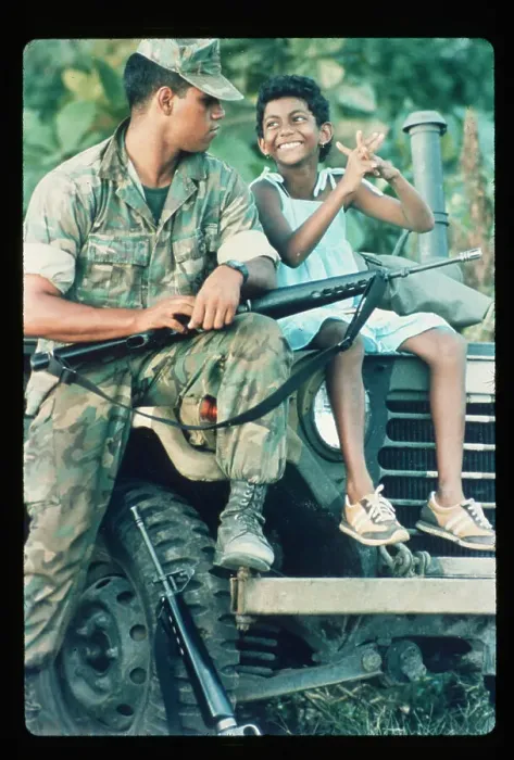 Framed Print : Marine Chats with Grenadian Girl on Jeep Framed Print : Marine Chats with Grenadian Girl on Jeep