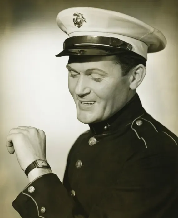 Framed Print : Marine in military uniform looking at wristwatch in studio, (B&W) Framed Print : Marine in military uniform looking at wristwatch in studio, (B&W)
