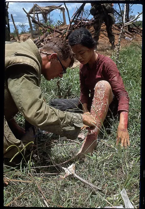 Framed Print : US Marine Treating a Vietnamese Girl Framed Print : US Marine Treating a Vietnamese Girl